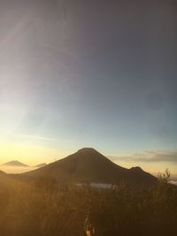 Scenic view of landscape against sky during sunset