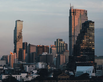 Modern buildings in city against sky