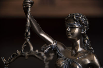 Law and judgment concept. figure of lady justice in notary office close-up.
