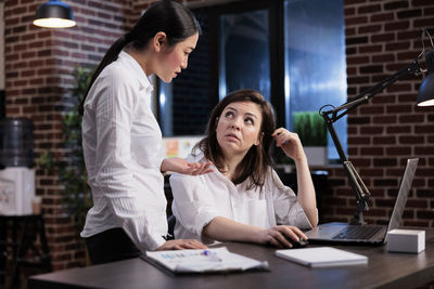 Business colleagues arguing at office