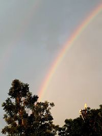 Low angle view of rainbow against sky
