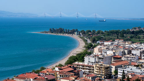 High angle view of sea and buildings against sky