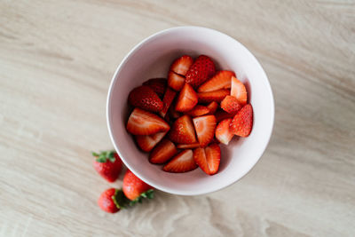 High angle view of chopped fruits in bowl on table