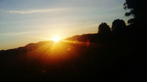 Scenic view of silhouette landscape against sky during sunset