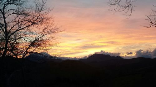 Scenic view of mountains against cloudy sky