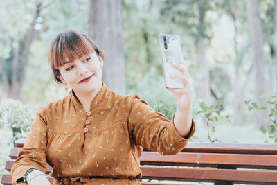 Young woman using mobile phone