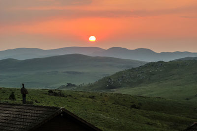 Scenic view of landscape against sky during sunset