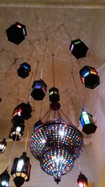 High angle view of illuminated lanterns hanging on table