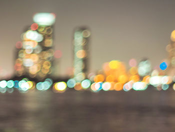 Defocused image of illuminated lights at night