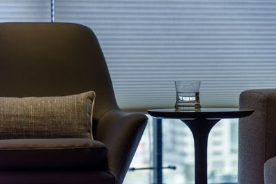 Close-up of sofa on table at home