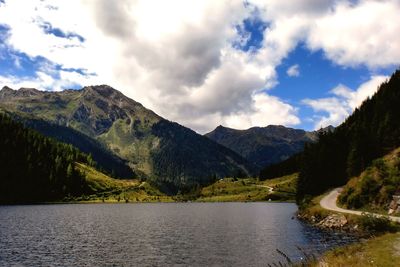 Scenic view of lake and mountains against sky