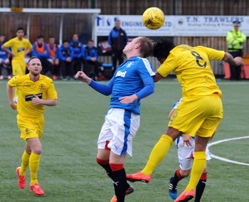 Group of people playing soccer