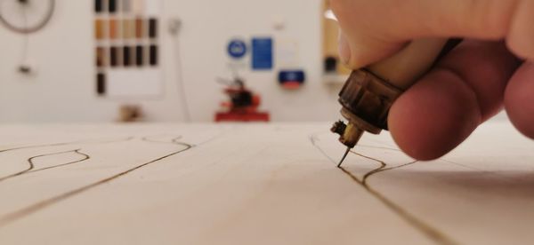 Cropped hands of man working on table