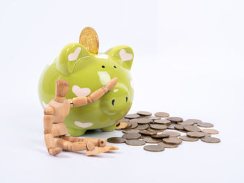 Close-up of coins on white background