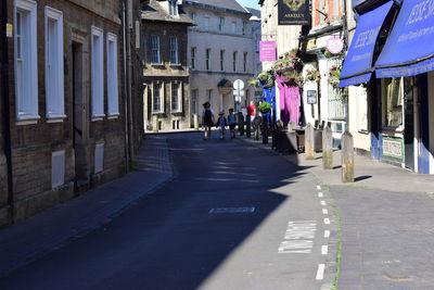 People walking on cobblestone street