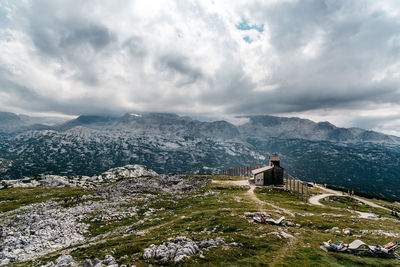 High angle view of mountain against cloudy sky