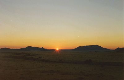 Scenic view of landscape at sunset