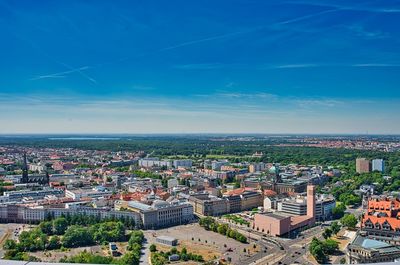 High angle view of townscape against blue sky