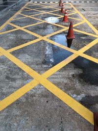 High angle view of arrow sign on road