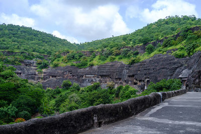 Narrow pathway along countryside landscape