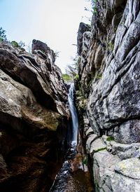 Waterfall amidst rock formations