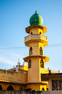 Low angle view of church against blue sky