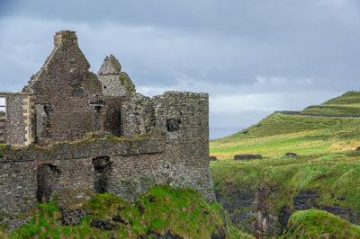 Old ruin building against cloudy sky