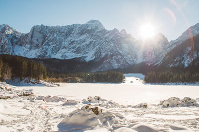 Scenic view of snowcapped mountains against sky