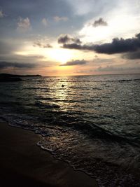 Scenic view of sea against sky at sunset