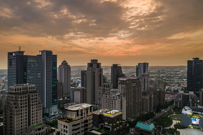 High angle view of buildings against sky during sunset