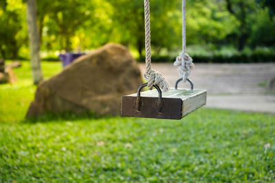 Close-up of swing at park