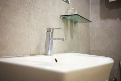 Bathroom interior with sink and faucet.