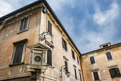 Low angle view of old building against sky