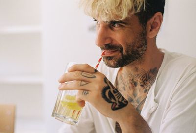 Close-up of mature man holding drink