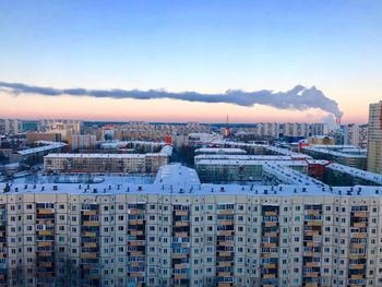 Cityscape against sky during winter