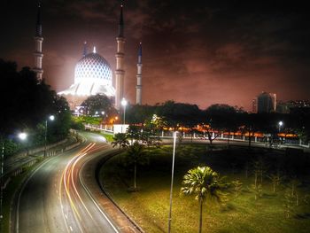 Illuminated buildings in city at night