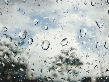 Full frame shot of raindrops on glass window