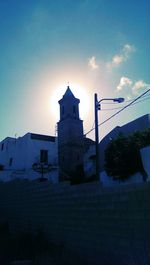 Built structures against sky at sunset