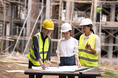 Rear view of man working at construction site