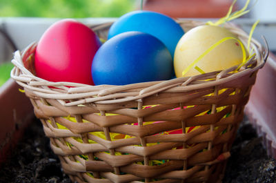 Close-up of colorful easter eggs in wicker basket