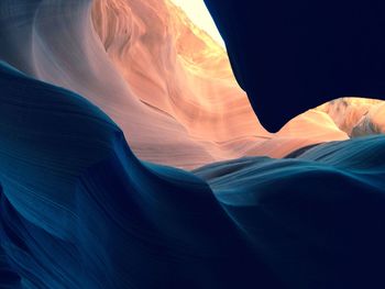 Low angle view of rock formation against blue sky