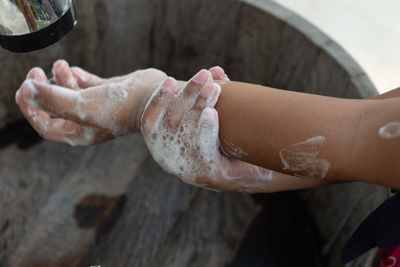 Close-up of person washing hands