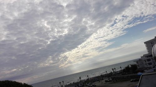 Scenic view of beach against sky during sunset