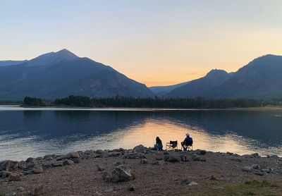 Scenic view of lake against sky during sunset