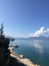 High angle view of sea against blue sky