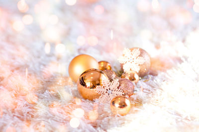 Close-up of christmas ornaments on fur