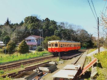 Train on railroad track against sky