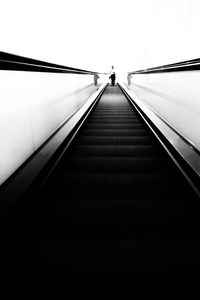 Low angle view of woman on staircase