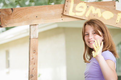 Portrait of a smiling girl with text