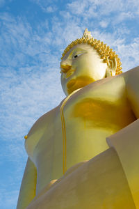 Low angle view of large buddha statue